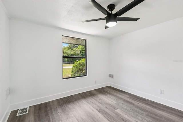 18015 Beach St, Umatilla, FL 32784 - empty room featuring dark wood finished floors, ceiling fan, and ornamental molding