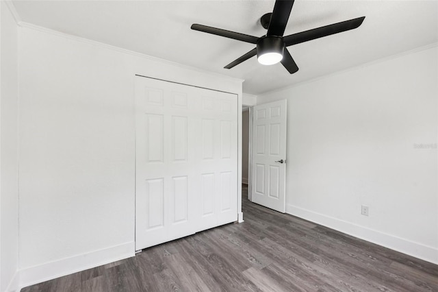 18015 Beach St, Umatilla, FL 32784 - unfurnished bedroom featuring dark wood-type flooring, ornamental molding, and a ceiling fan