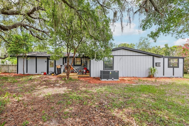18015 Beach St, Umatilla, FL 32784 - back of house with board and batten siding and a porch