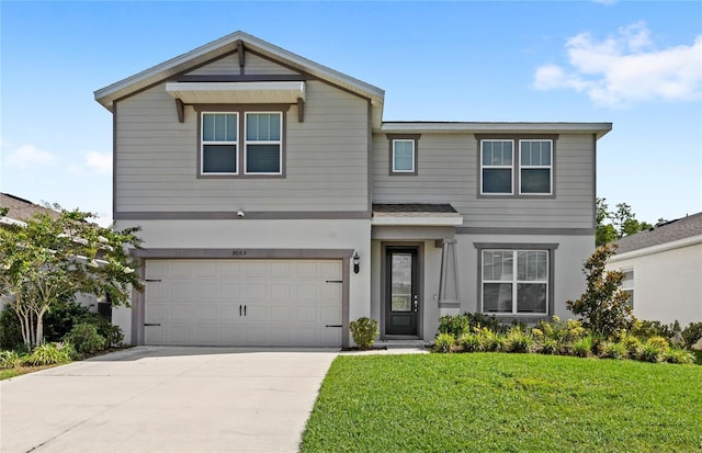 5065 Sparkling Water Way, Kissimmee, FL 34746 - view of front of property featuring a garage, a front lawn, driveway, and stucco siding