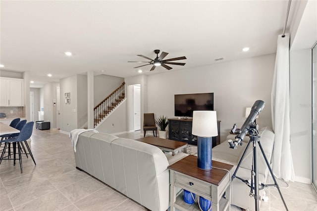 5065 Sparkling Water Way, Kissimmee, FL 34746 - living area with recessed lighting, ceiling fan, stairway, and light tile patterned floors