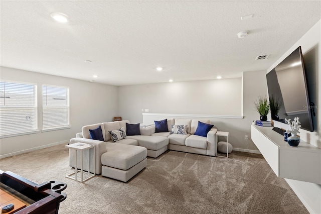 5065 Sparkling Water Way, Kissimmee, FL 34746 - carpeted living room with a textured ceiling and recessed lighting