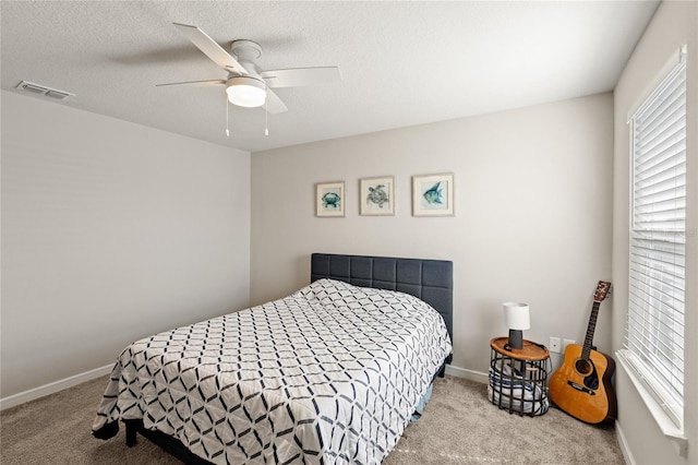 5065 Sparkling Water Way, Kissimmee, FL 34746 - bedroom featuring carpet flooring, ceiling fan, and a textured ceiling