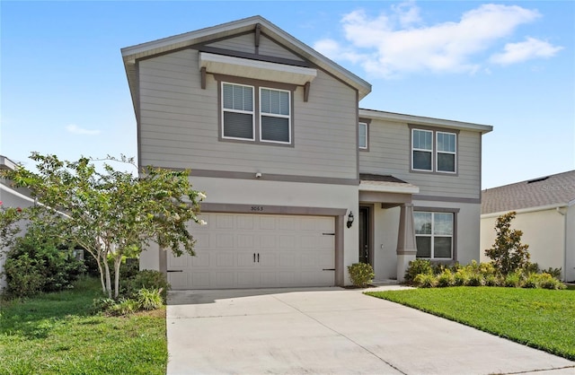 5065 Sparkling Water Way, Kissimmee, FL 34746 - view of front of home featuring driveway, a garage, a front yard, and stucco siding