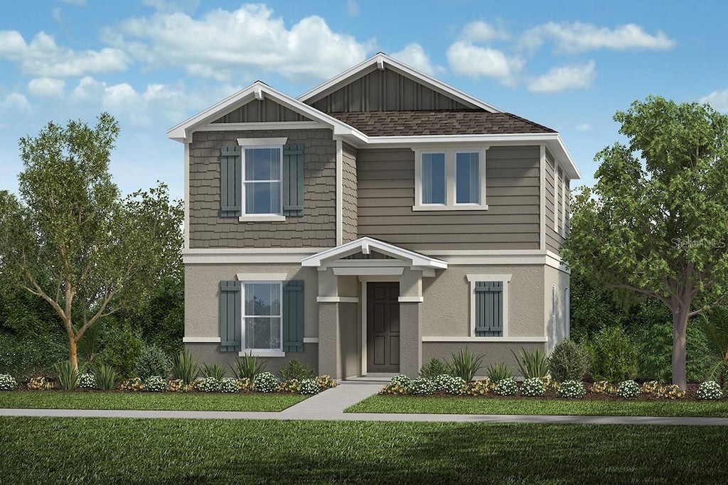 742 Overpool Ave, Davenport, FL 33896 - craftsman house with a front lawn and board and batten siding