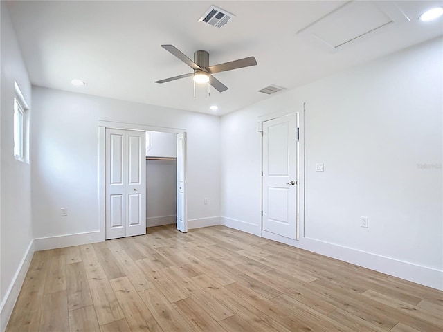 7341 Hart St, Englewood, FL 34224 - unfurnished bedroom featuring light wood-type flooring, recessed lighting, attic access, a ceiling fan, and a closet