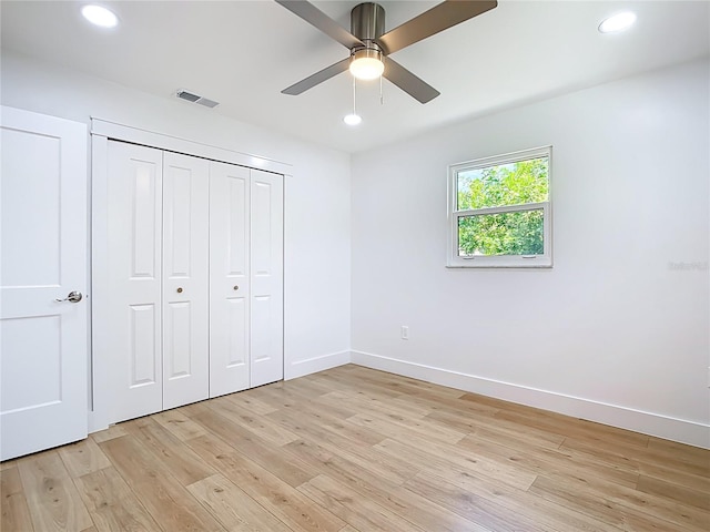 7341 Hart St, Englewood, FL 34224 - unfurnished bedroom featuring light wood finished floors, recessed lighting, a closet, and a ceiling fan