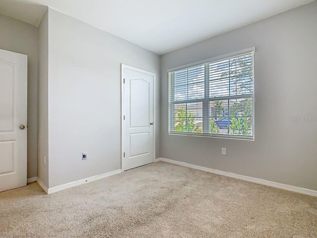 313 Sofia Ln, Lake Alfred, FL 33850 - unfurnished bedroom featuring light carpet