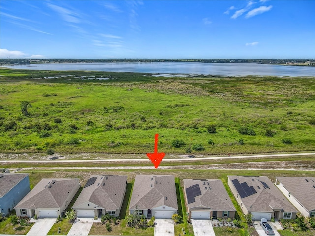 313 Sofia Ln, Lake Alfred, FL 33850 - aerial view of residential area with a large body of water