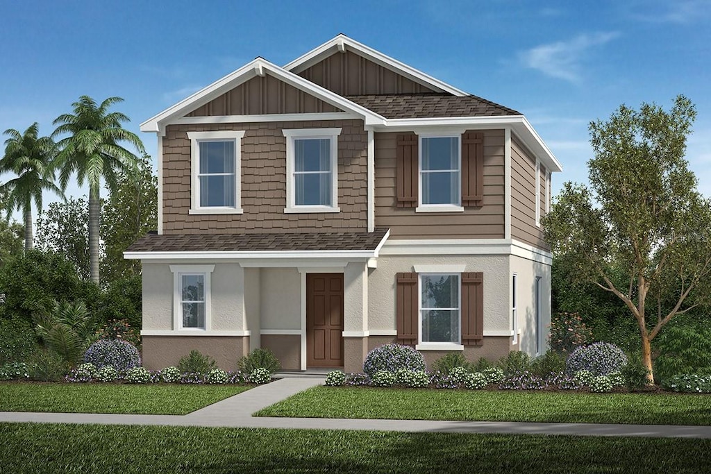 9644 Westside Hills Dr, Davenport, FL 33896 - view of front of property with board and batten siding, a shingled roof, a front lawn, and stucco siding
