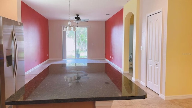 12630 Old Plantation Ln, Orlando, FL 32824 - unfurnished dining area featuring arched walkways, light tile patterned floors, and ceiling fan
