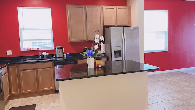 12630 Old Plantation Ln, Orlando, FL 32824 - kitchen featuring stainless steel appliances, plenty of natural light, light tile patterned floors, and a kitchen island