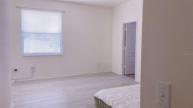 12630 Old Plantation Ln, Orlando, FL 32824 - bedroom featuring light wood-style flooring and baseboards