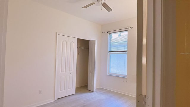12630 Old Plantation Ln, Orlando, FL 32824 - unfurnished bedroom featuring light wood-style flooring, a closet, and ceiling fan