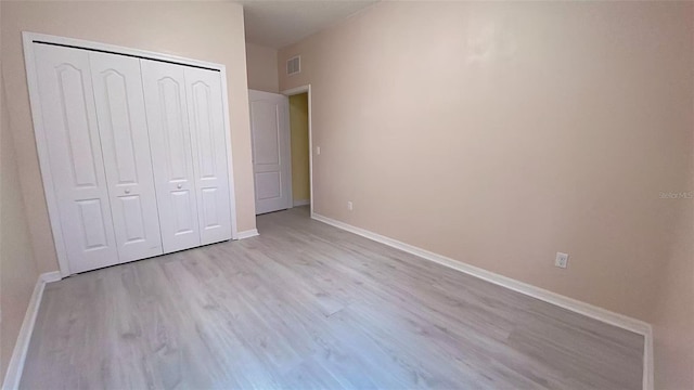12630 Old Plantation Ln, Orlando, FL 32824 - unfurnished bedroom featuring light wood-style floors and a closet