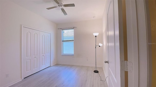 12630 Old Plantation Ln, Orlando, FL 32824 - unfurnished bedroom with light wood-style floors, a closet, and a ceiling fan