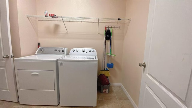 12630 Old Plantation Ln, Orlando, FL 32824 - washroom with independent washer and dryer and light tile patterned flooring
