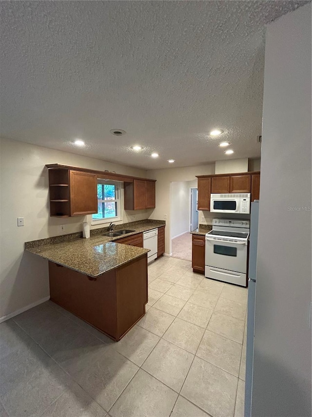 9504 W Cluster Ave, Tampa, FL 33615 - kitchen featuring white appliances, open shelves, a peninsula, a textured ceiling, and recessed lighting