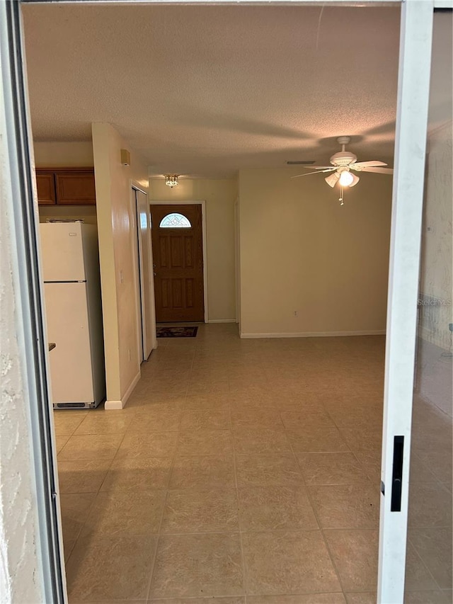 9504 W Cluster Ave, Tampa, FL 33615 - hall with a textured ceiling and baseboards