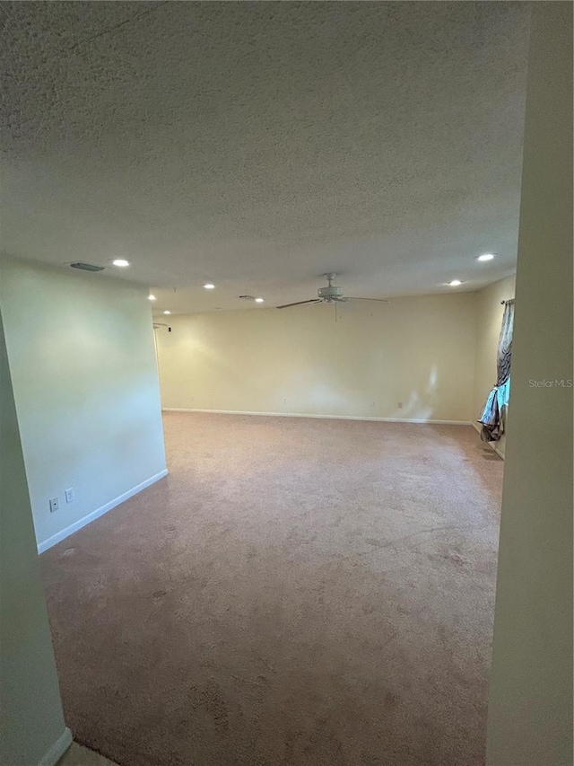 9504 W Cluster Ave, Tampa, FL 33615 - empty room with carpet, recessed lighting, a textured ceiling, and ceiling fan