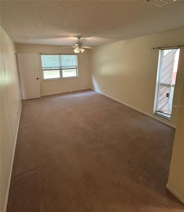 9504 W Cluster Ave, Tampa, FL 33615 - carpeted spare room with ceiling fan and a textured ceiling
