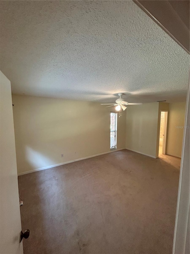 9504 W Cluster Ave, Tampa, FL 33615 - carpeted empty room featuring ceiling fan and a textured ceiling