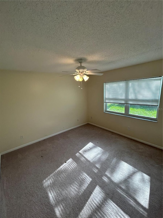 9504 W Cluster Ave, Tampa, FL 33615 - carpeted empty room with a textured ceiling and a ceiling fan