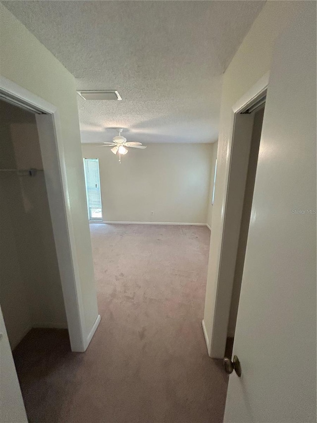 9504 W Cluster Ave, Tampa, FL 33615 - corridor featuring carpet and a textured ceiling
