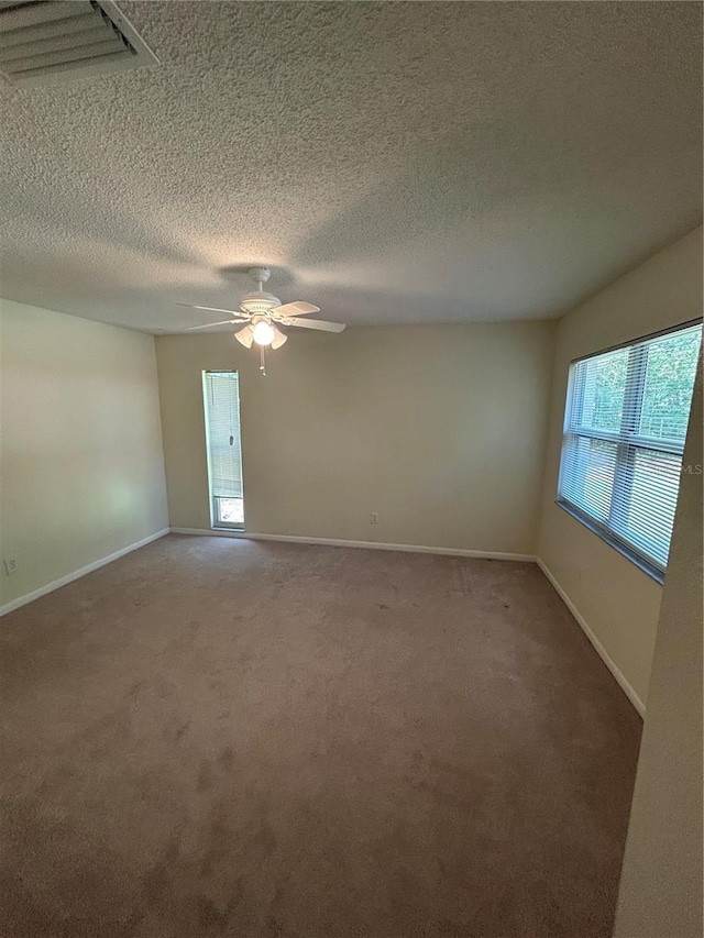 9504 W Cluster Ave, Tampa, FL 33615 - unfurnished room featuring light colored carpet, a ceiling fan, and a textured ceiling