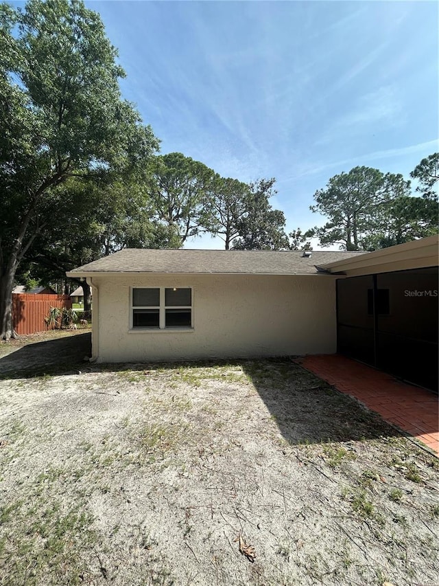 9504 W Cluster Ave, Tampa, FL 33615 - rear view of property featuring stucco siding