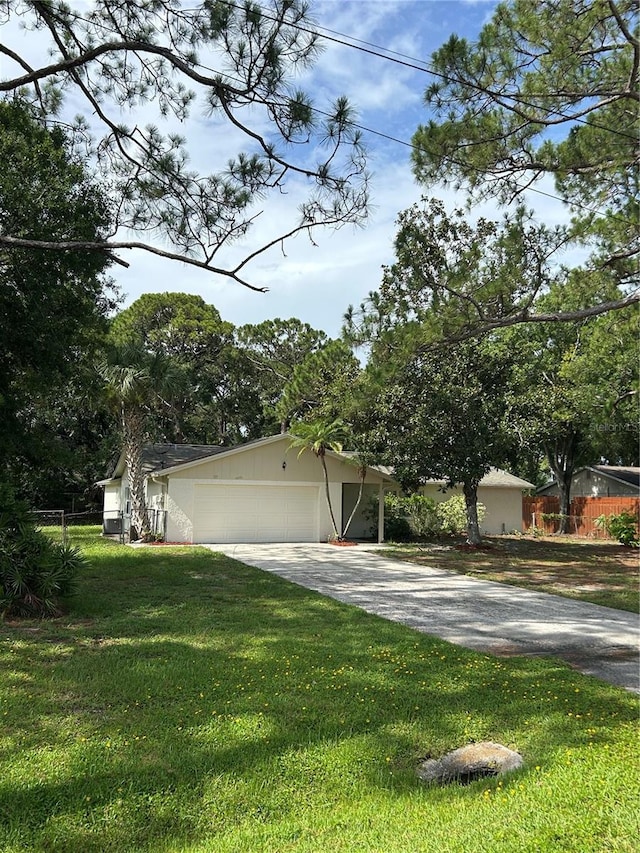 9504 W Cluster Ave, Tampa, FL 33615 - view of front of house with asphalt driveway and an attached garage
