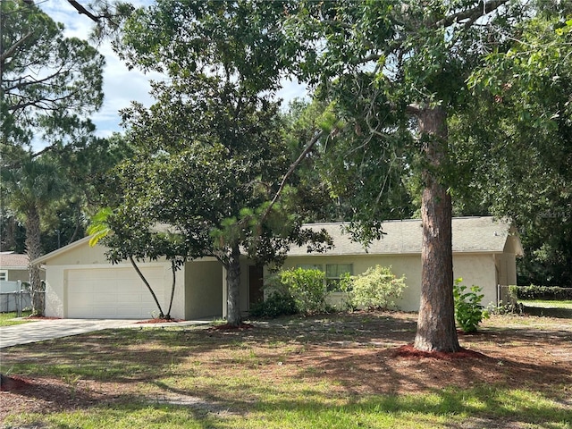 9504 W Cluster Ave, Tampa, FL 33615 - view of front of home with a garage and concrete driveway