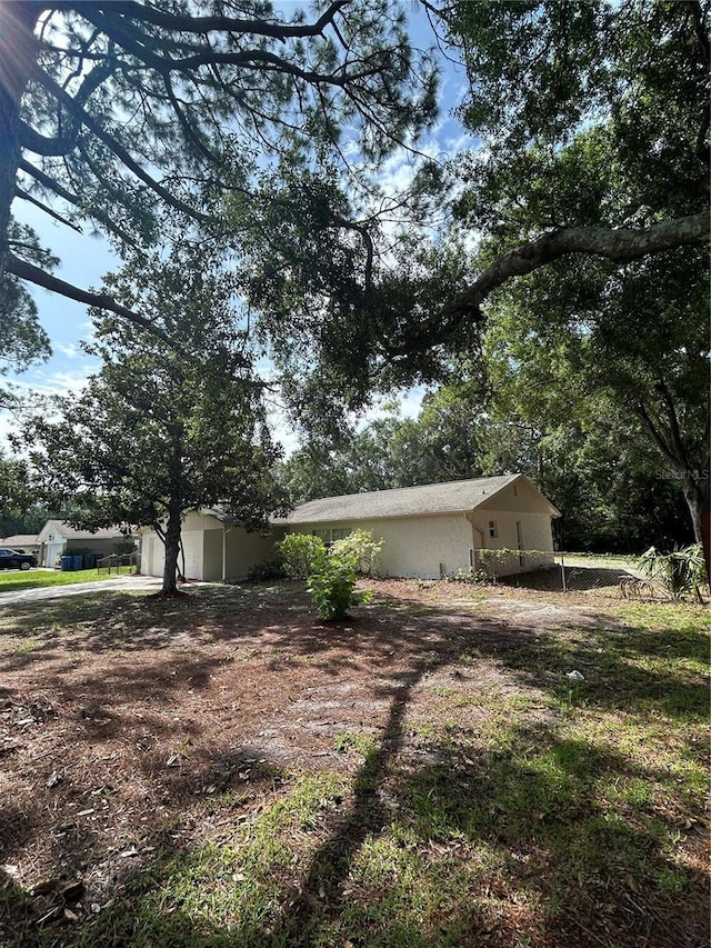 9504 W Cluster Ave, Tampa, FL 33615 - view of home's exterior with stucco siding