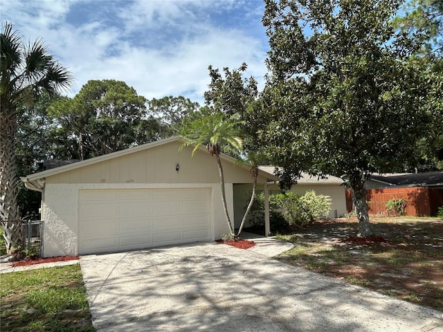 9504 W Cluster Ave, Tampa, FL 33615 - view of front of home with concrete driveway and a garage