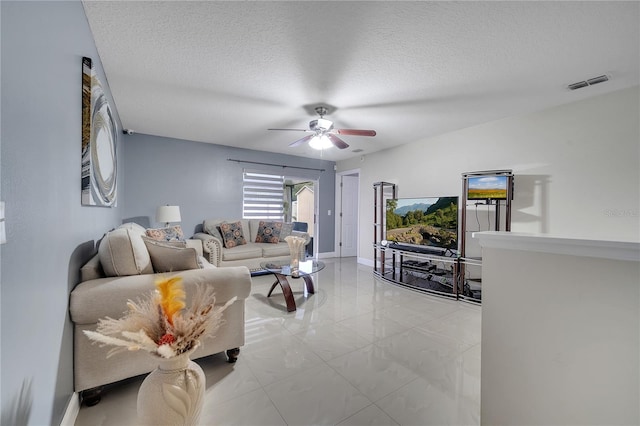 13217 Briar Forest Ct, Orlando, FL 32828 - living room featuring a ceiling fan and a textured ceiling
