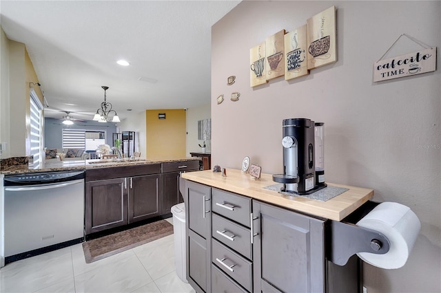 13217 Briar Forest Ct, Orlando, FL 32828 - kitchen featuring dishwasher, open floor plan, ceiling fan, decorative light fixtures, and dark brown cabinetry
