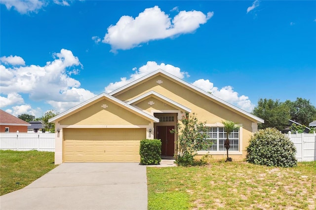 118 Sir Phillips Dr, Davenport, FL 33837 - view of front facade featuring stucco siding, driveway, and an attached garage