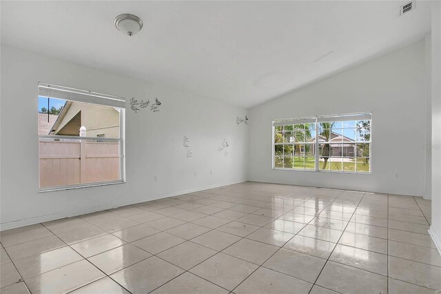 118 Sir Phillips Dr, Davenport, FL 33837 - empty room featuring vaulted ceiling and light tile patterned floors
