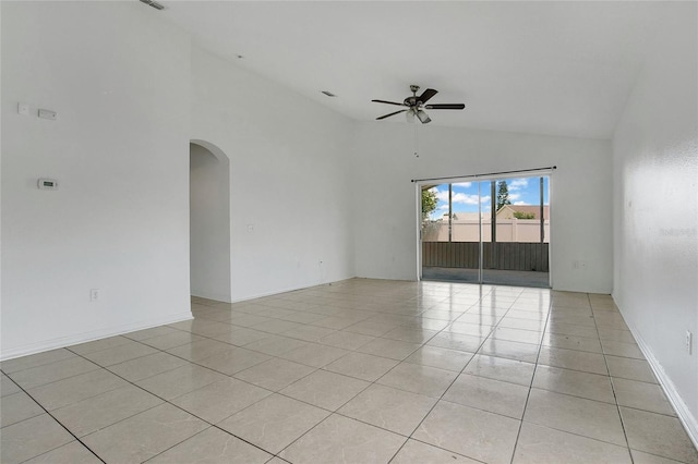 118 Sir Phillips Dr, Davenport, FL 33837 - empty room with ceiling fan, arched walkways, light tile patterned floors, and high vaulted ceiling