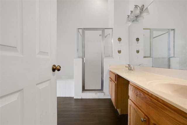 118 Sir Phillips Dr, Davenport, FL 33837 - full bath featuring a stall shower, double vanity, wood finished floors, and a tub