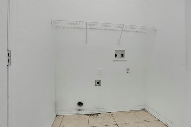 118 Sir Phillips Dr, Davenport, FL 33837 - laundry room featuring washer hookup, electric dryer hookup, and light tile patterned flooring
