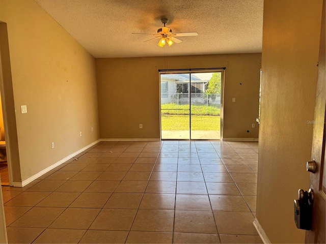 2207 Robel Trl, Clermont, FL 34714 - empty room with a textured ceiling, ceiling fan, and light tile patterned floors