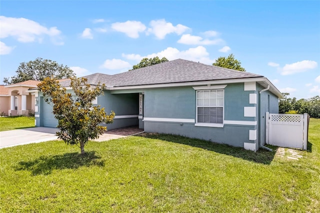 141 Winsor Ave, Davenport, FL 33837 - ranch-style house featuring stucco siding, roof with shingles, an attached garage, and concrete driveway