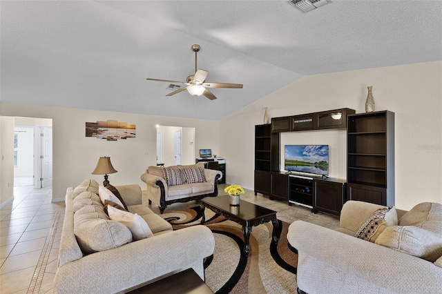 141 Winsor Ave, Davenport, FL 33837 - living room with a ceiling fan, lofted ceiling, and light tile patterned floors