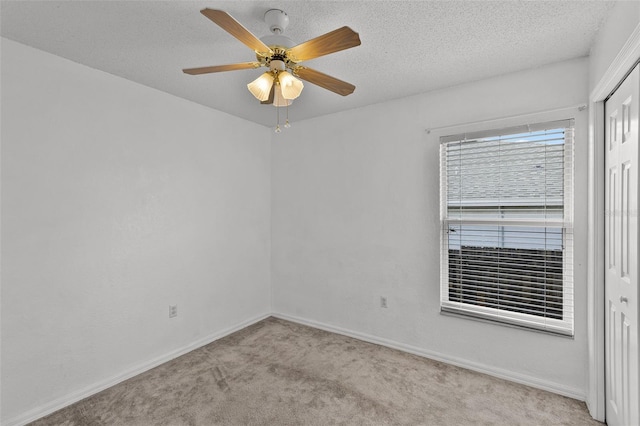 141 Winsor Ave, Davenport, FL 33837 - empty room featuring light carpet, a ceiling fan, and a textured ceiling