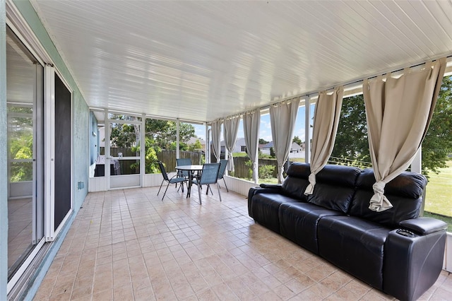 141 Winsor Ave, Davenport, FL 33837 - sunroom / solarium with outdoor dining space, an outdoor hangout area, floor to ceiling windows, and tile patterned floors