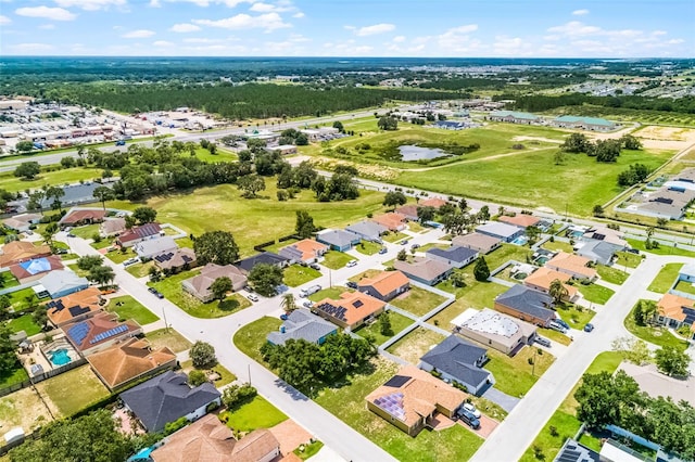 141 Winsor Ave, Davenport, FL 33837 - aerial view of residential area with a nearby body of water