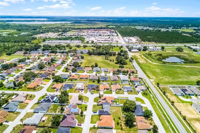 141 Winsor Ave, Davenport, FL 33837 - aerial perspective of suburban area featuring a nearby body of water