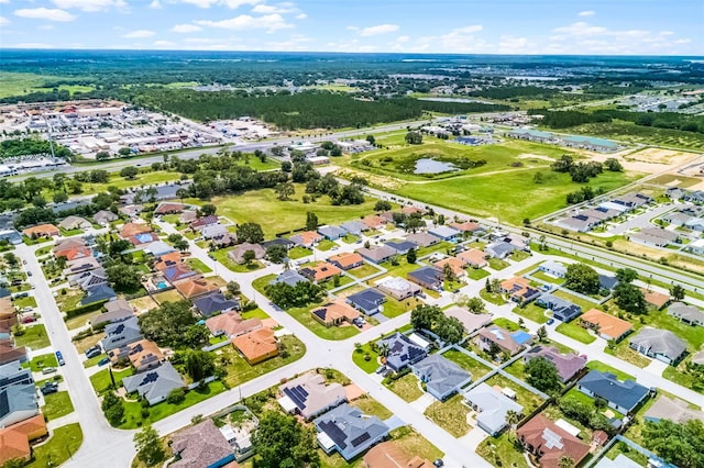 141 Winsor Ave, Davenport, FL 33837 - aerial view of property and surrounding area with nearby suburban area and a nearby body of water