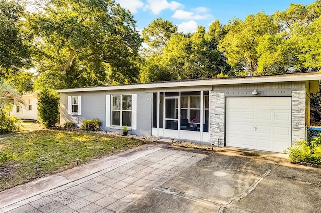 1649 Weybridge St, Deltona, FL 32725 - ranch-style home featuring driveway, an attached garage, and a front lawn